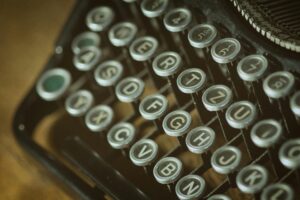 pexels-photo-101710-101710 Close-up view of a vintage typewriter keyboard with round keys from an old typing device.
